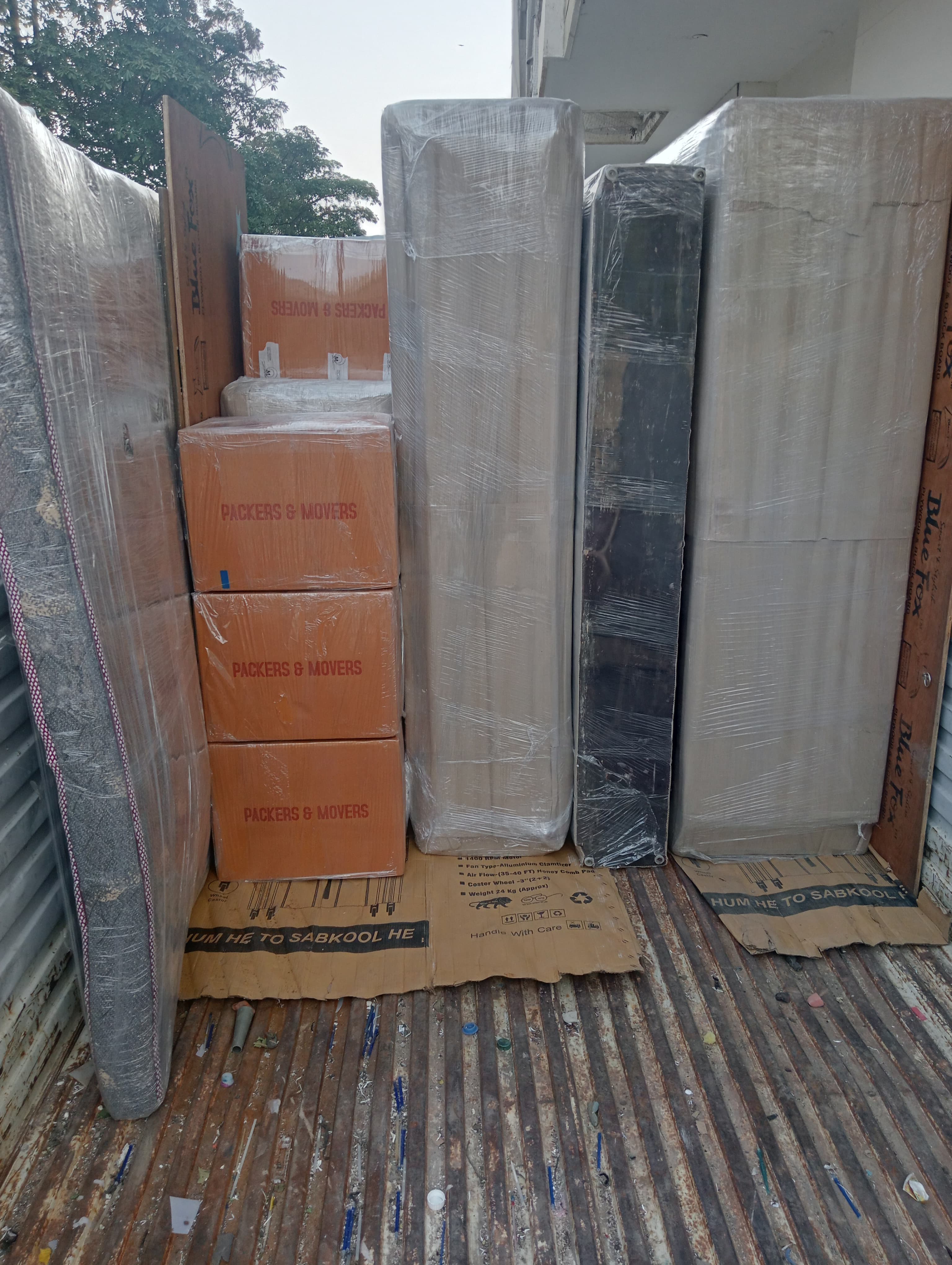 Movers loading a grandfather clock